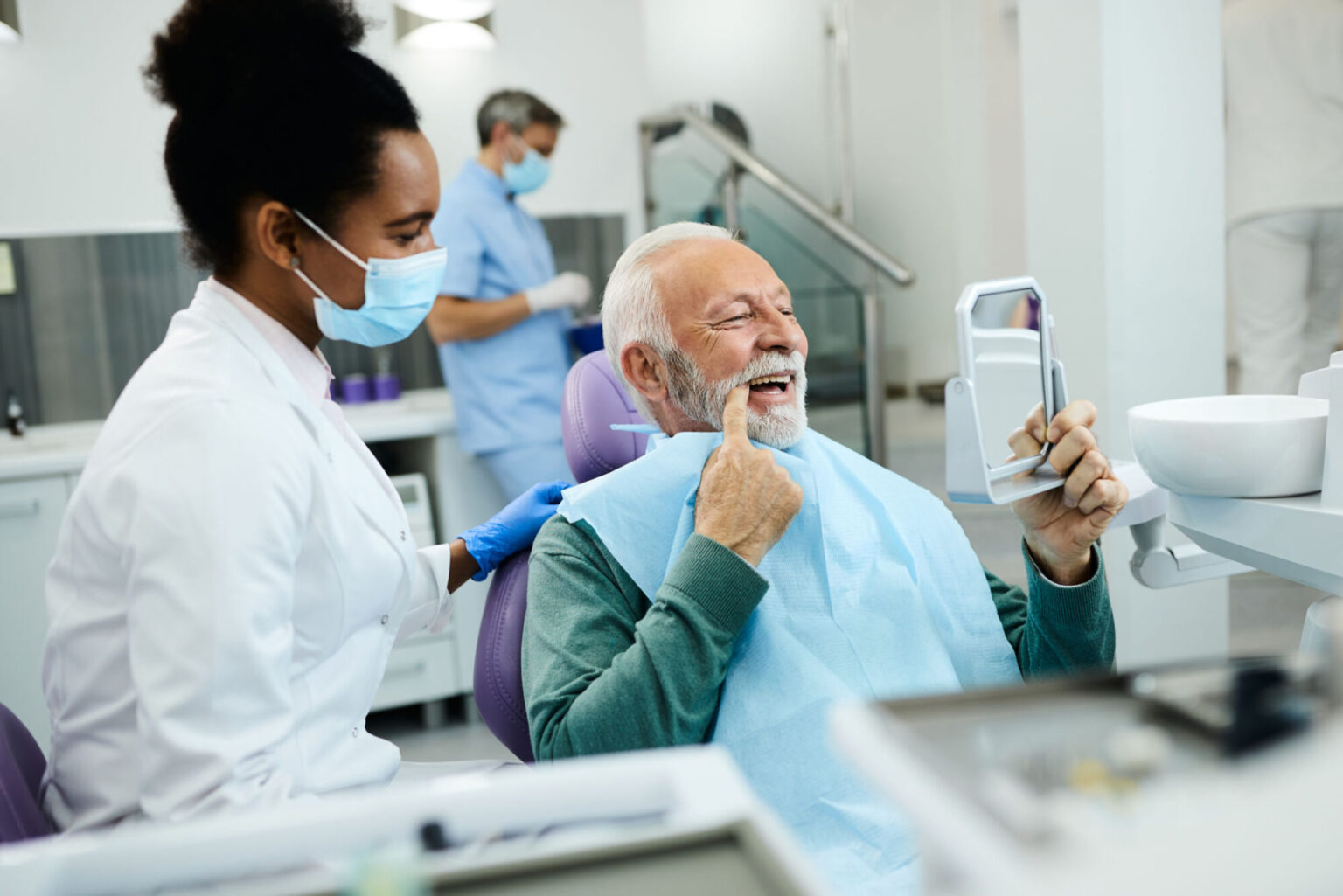 a old man is checking his teeth