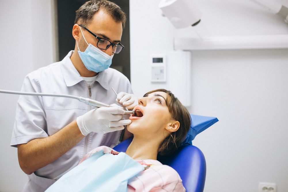 a young lady is having swollen jaw treatment