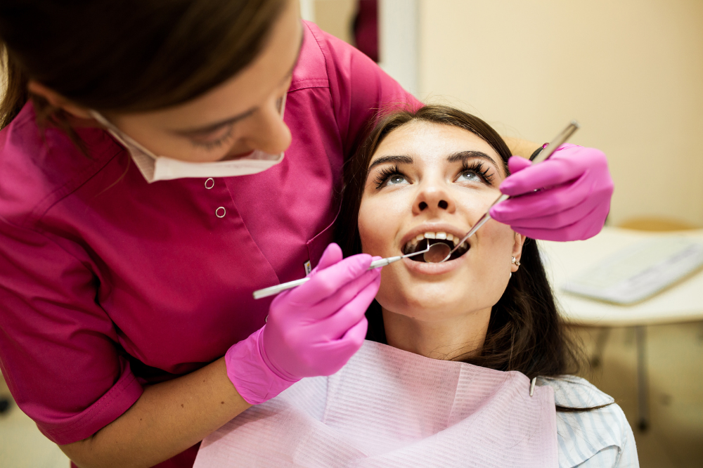 a woman is having latest cosmetic dentistry treatment